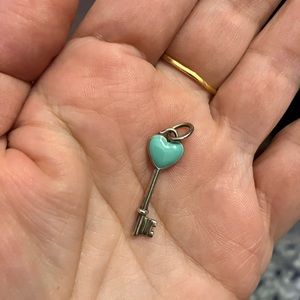 Authentic Tiffany & Co. Enamel Heart Key Retired pendant.